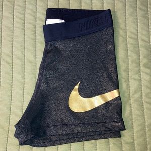 Black and gold Nike Pro spandex